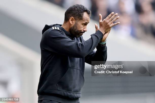 Head coach Daniel Thioune of Düsseldorf applauds his team after winning 2-0 the Second Bundesliga match between Fortuna Düsseldorf and Eintracht...