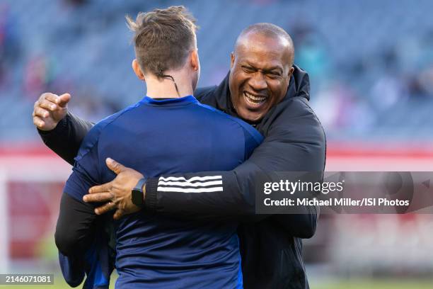 Assistant coach Zach Thornton of Chicago Fire hugs Steve Clark of Houston Dynamo before a game between Houston Dynamo FC and Chicago Fire FC at...