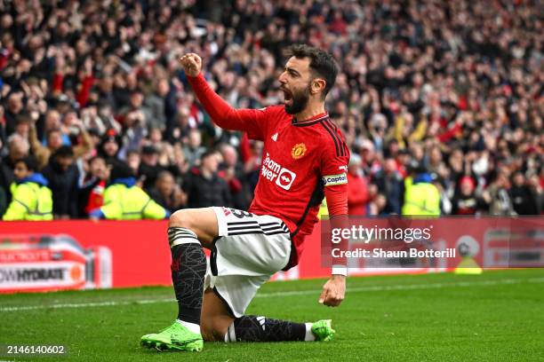 Bruno Fernandes of Manchester United celebrates scoring his team's first goal during the Premier League match between Manchester United and Liverpool...