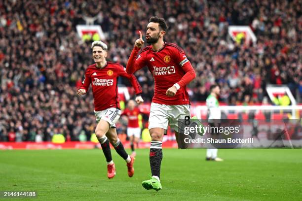 Bruno Fernandes of Manchester United celebrates scoring his team's first goal during the Premier League match between Manchester United and Liverpool...