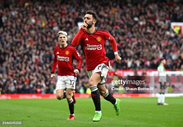 Bruno Fernandes of Manchester United celebrates scoring his team's first goal during the Premier League match between Manchester United and Liverpool...