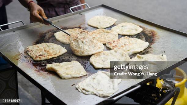 hand making roti canai - roti canai stock pictures, royalty-free photos & images