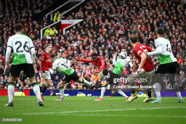 Kobbie Mainoo of Manchester United scores his team's second goal during the Premier League match between Manchester United and Liverpool FC at Old...