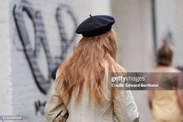 Guest wears a black beret / hat, outside Proenza Schouler , during New York Fashion Week, on February 10, 2024 in New York City.