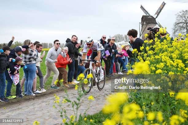 Mathieu van der Poel of The Netherlands and Team Alpecin - Deceuninck competes in the breakaway passing through the Templeuve cobblestones sector...