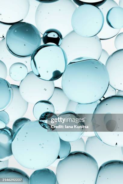 blue molecules, water drops. 3d liquid bubbles pattern. beauty vertical background. healthcare and medicine. close-up. design element. - ácido hialurónico fotografías e imágenes de stock