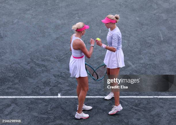 Lyudmyla Kichenok and Nadiia Kichenok of the Ukraine talk in the first set against Ashlyn Krueger and Sloane Stephens of the United States during the...