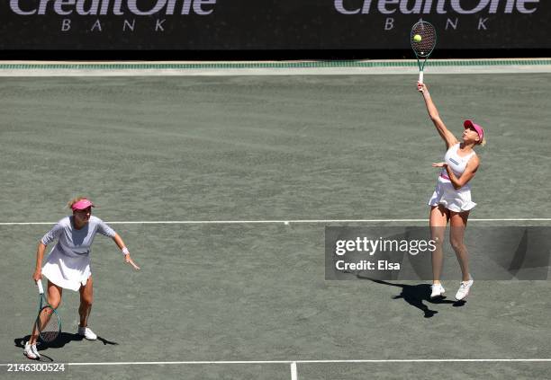 The doubles team of Lyudmyla Kichenok and Nadiia Kichenok of the Ukraine returns a shot in the first set against Ashlyn Krueger and Sloane Stephens...