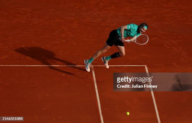 Alexander Bublik of Kazakhstan stretches for a shot in his first round match against Borna Coric of Croatia during day one of the Rolex Monte-Carlo...