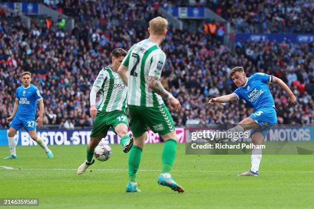 Harrison Burrows of Peterborough United scores his team's first goal during the Bristol Street Motors Trophy Final between Peterborough United and...