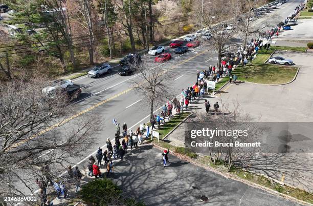 In an aerial view, marchers walk the designated route along Old Country Road during the "Bring Them Home NOW" walk and rally on April 07, 2024 in...