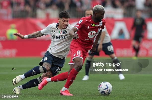 Jean-Daniel Akpa Akpro of AC Monza battles for the ball with Mathias Olivera of SSC Napoli during the Serie A TIM match between AC Monza and SSC...