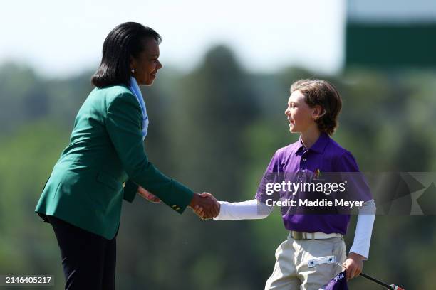 Texas Terry of the Boy's 10-11 group shakes hands with Former United States Secretary of State Condoleezza Rice during the Drive, Chip and Putt...