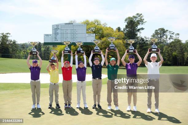 The champions pose with their trophies after the Drive, Chip and Putt Championship at Augusta National Golf Club at Augusta National Golf Club on...