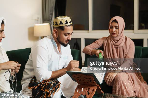 indian islam friends immersed in quran recitation during ramadan - prayer beads stock pictures, royalty-free photos & images