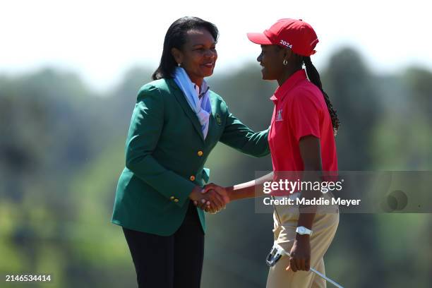 Ariel Collins of the Girl's 14-15 group shakes hands with Former United States Secretary of State Condoleezza Rice during the Drive, Chip and Putt...