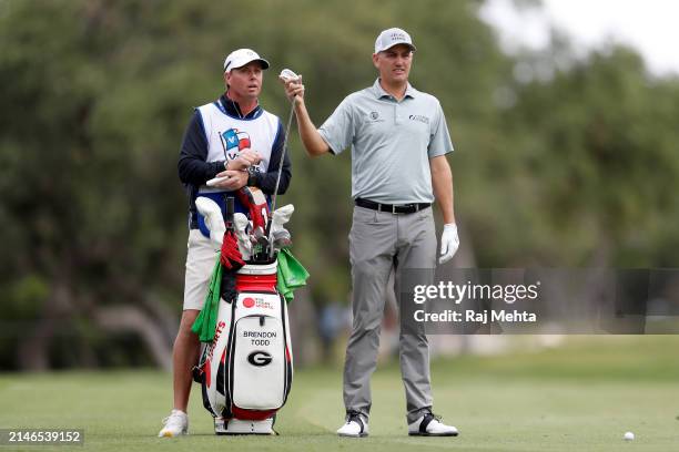 Brendon Todd of the United States prepares to play his second shot on the 1st hole during the final round of the Valero Texas Open at TPC San Antonio...