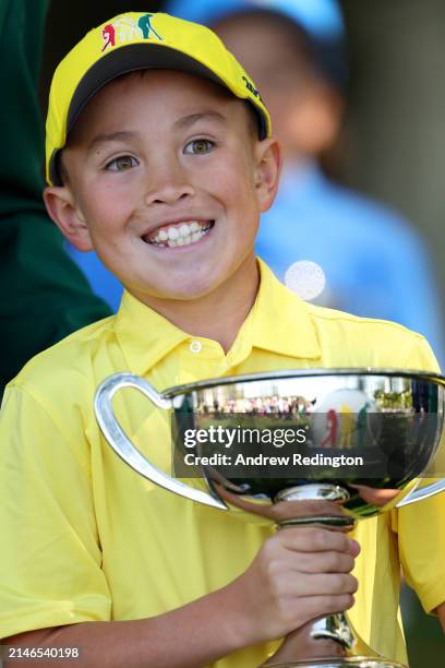 Parker Tang, first place overall in the Boy's 7-9 group, poses during the Drive, Chip and Putt Championship at Augusta National Golf Club at Augusta...