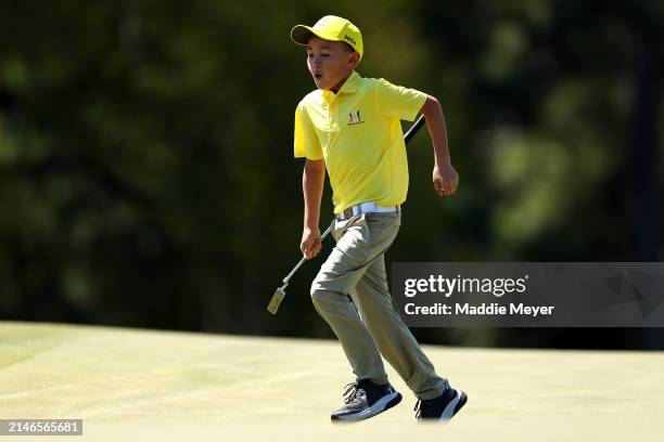 Parker Tang, first place overall in the Boy's 7-9 group, participates in the Drive, Chip and Putt Championship at Augusta National Golf Club at...