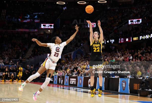 Caitlin Clark of the Iowa Hawkeyes shoots a three point basket over Bree Hall of the South Carolina Gamecocks in the first half during the 2024 NCAA...