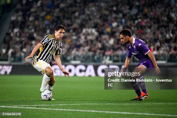 Federico Chiesa of Juventus is challenged by Giacomo Bonaventura of ACF Fiorentina during the Serie A TIM match between Juventus and ACF Fiorentina...