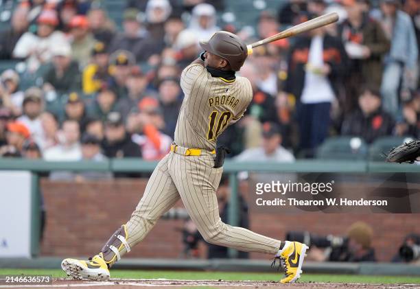 Jurickson Profar of the San Diego Padres hits a grand slam home run against the San Francisco Giants in the top of the first inning at Oracle Park on...