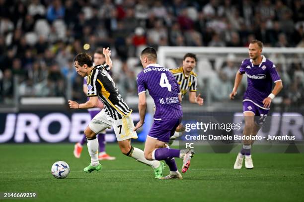 Federico Chiesa of Juventus is challenged by Nikola Milenkovic of ACF Fiorentina during the Serie A TIM match between Juventus and ACF Fiorentina at...