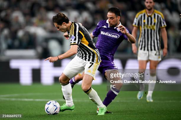 Federico Chiesa of Juventus fights for the ball with Giacomo Bonaventura of ACF Fiorentina during the Serie A TIM match between Juventus and ACF...