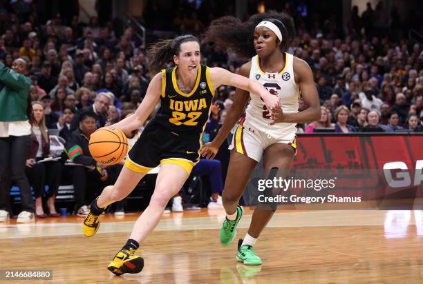 Caitlin Clark of the Iowa Hawkeyes works the ball around Raven Johnson of the South Carolina Gamecocks in the first half during the 2024 NCAA Women's...
