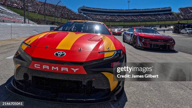 Bubba Wallace, driver of the McDonald's Toyota, and Kyle Larson, driver of the HendrickCars.com Ruby Chevrolet, lead the field on a pace lap prior to...