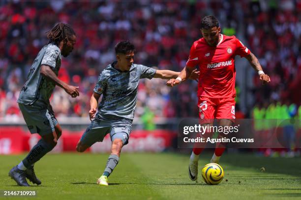 Idekel Dominguez of Atlas fights for the ball with Alexis Vega of Toluca during the 14th round match between Toluca and Atlas as part of the Torneo...