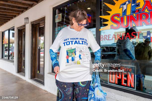 Traveler Lynne Kueck displays her 'Total Eclipse' attire ahead of the total solar eclipse on April 07, 2024 in Fredericksburg, Texas. Millions of...