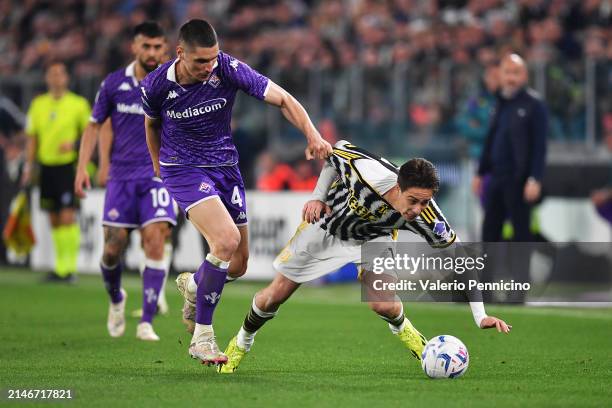 Kenan Yilidiz of Juventus has his shirt pulled back by Nikola Milenkovic of ACF Fiorentina during the Serie A TIM match between Juventus and ACF...