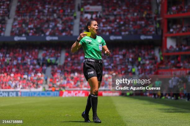 Referee Karen Hernandez shows a yellow card during the 14th round match between Toluca and Atlas as part of the Torneo Clausura 2024 Liga MX at...