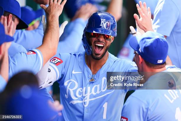 Melendez of the Kansas City Royals celebrates with teammates after hitting a home run against the Chicago White Sox during the seventh inning at...