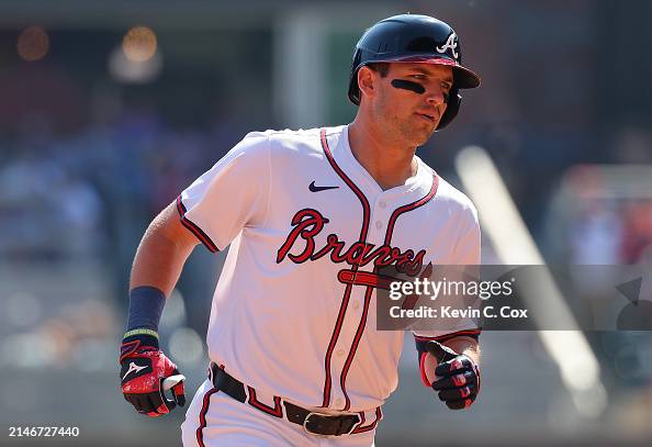 Austin Riley Third Base Austin Riley of the Atlanta Braves reacts as he rounds third base ...