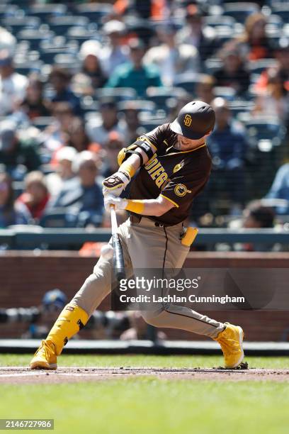 Jake Cronenworth of the San Diego Padres hits an RBI double in the top of the first inning against the San Francisco Giants at Oracle Park on April...