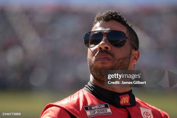 Bubba Wallace, driver of the McDonald's Toyota, waits on the grid prior to the NASCAR Cup Series Cook Out 400 at Martinsville Speedway on April 07,...