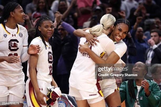 Bree Hall celebrates with Chloe Kitts of the South Carolina Gamecocks in the second half during the 2024 NCAA Women's Basketball Tournament National...