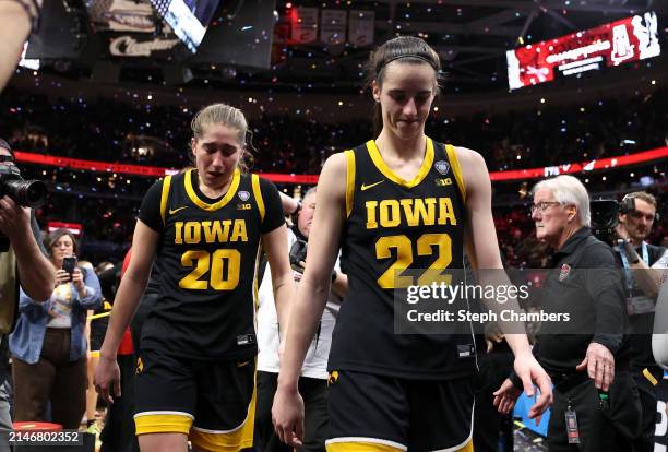 Caitlin Clark and Kate Martin of the Iowa Hawkeyes walk off the court after losing to the South Carolina Gamecocks in the 2024 NCAA Women's...