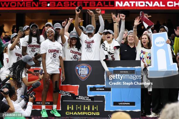 The South Carolina Gamecocks celebrate after beating the Iowa Hawkeyes in the 2024 NCAA Women's Basketball Tournament National Championship at Rocket...