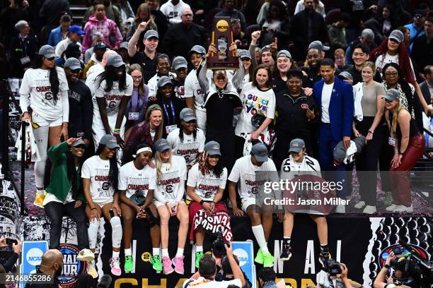 The South Carolina Gamecocks celebrate after beating the Iowa Hawkeyes in the 2024 NCAA Women's Basketball Tournament National Championship at Rocket...