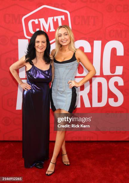 Leslie Fram, Senior VP of Music Strategy for CMT, and Brandi Cyrus attend the 2024 CMT Music Awards at Moody Center on April 07, 2024 in Austin,...