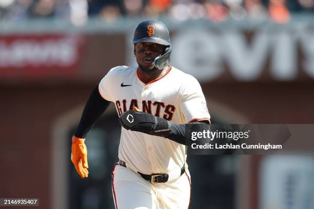 Jorge Soler of the San Francisco Giants advances to third base on a fielding error by Ha-Seong Kim of the San Diego Padres in the bottom of the...