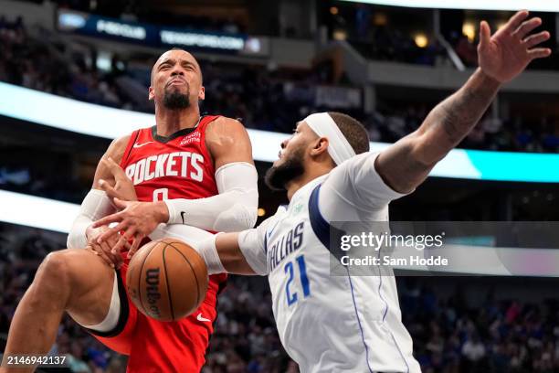 Dillon Brooks of the Houston Rockets is blocked by Daniel Gafford of the Dallas Mavericks during the second half at American Airlines Center on April...