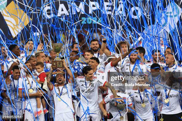 De Arrascaeta of Flamengo lifts the champions trophy after winning the second leg of the final of Campeonato Carioca 2024 between Nova Iguaçu and...