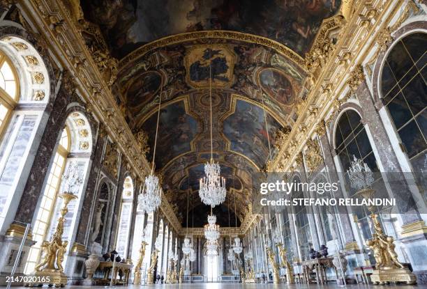 This photograph taken on April 8 shows the Galerie des Glaces, also known as Grande Galerie, located in the Chateau de Versailles , in Versailles,...