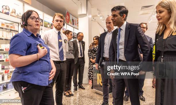 Prime Minister Rishi Sunak talks with staff in a Boots store in Horsham West Sussex about their anti harassment and shop lifting protocols which...