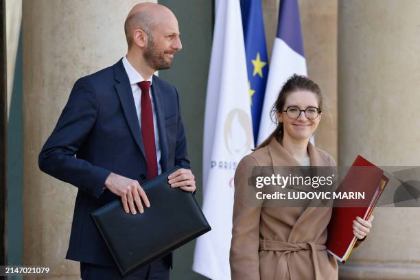 France's Minister for Transformation and Public Services Stanislas Guerini and France's Deputy Minister for Gender Equality Aurore Berge leave after...