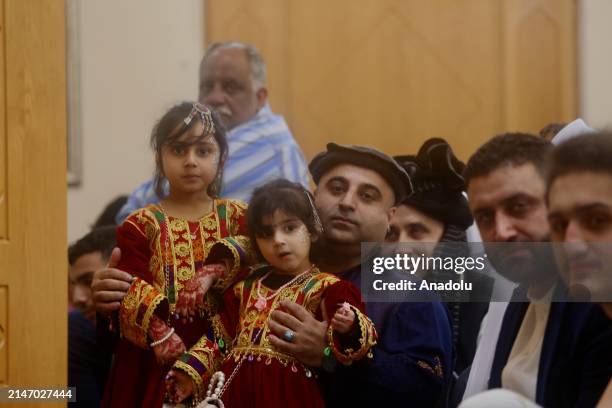 Girls wearing traditional dresses are seen as Muslims gather to perform Eid al-Fitr prayer at the Islamic Cultural Center and Dublin mosque in...